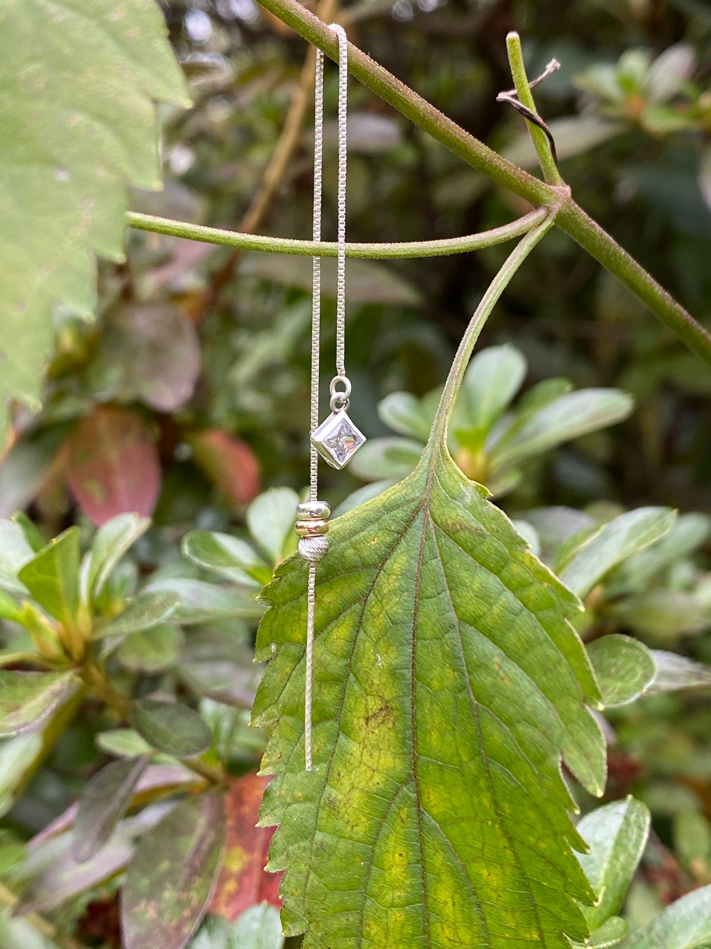 princess cut with silver stopper bead