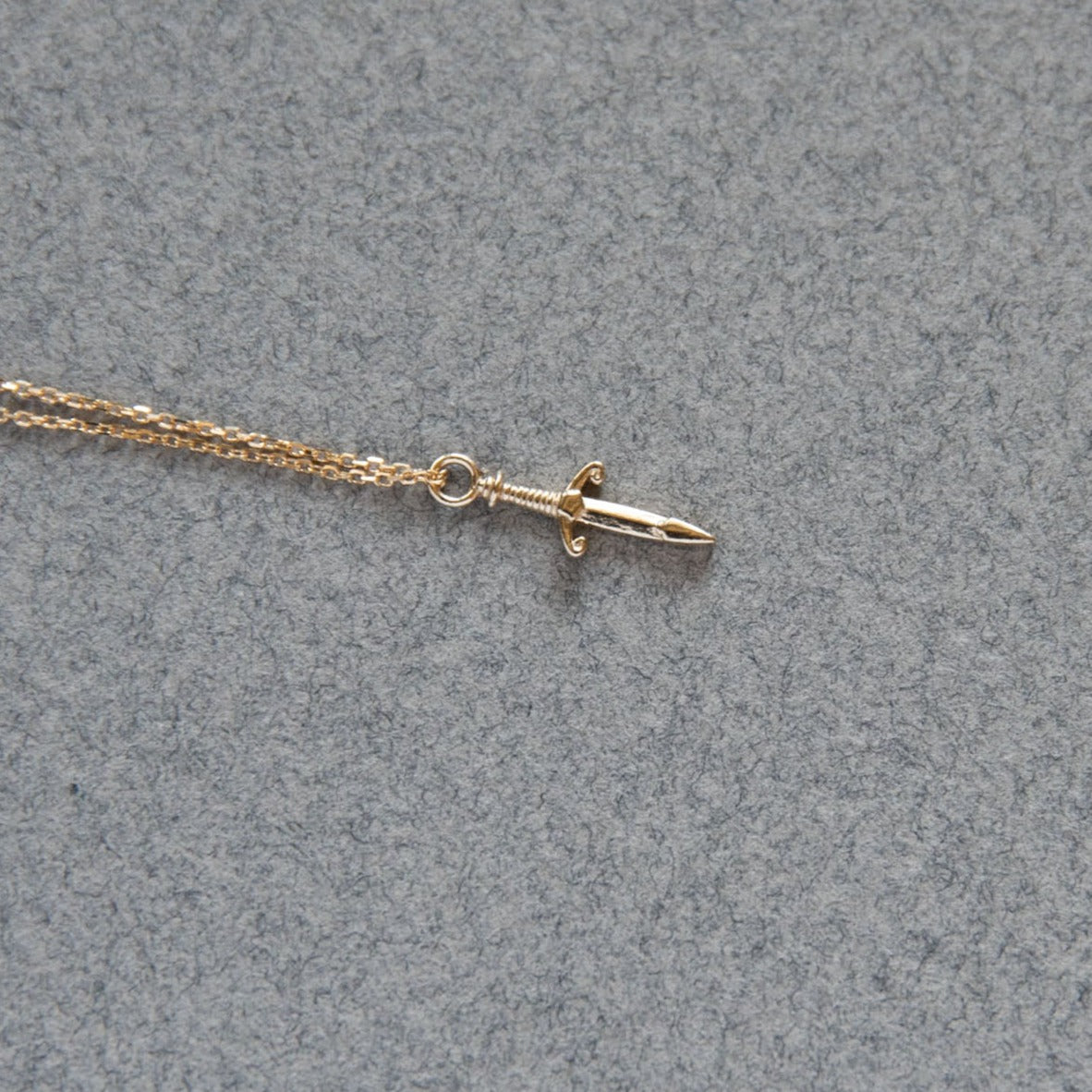 gold dagger charm